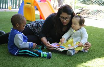 teacher reading to toddlers